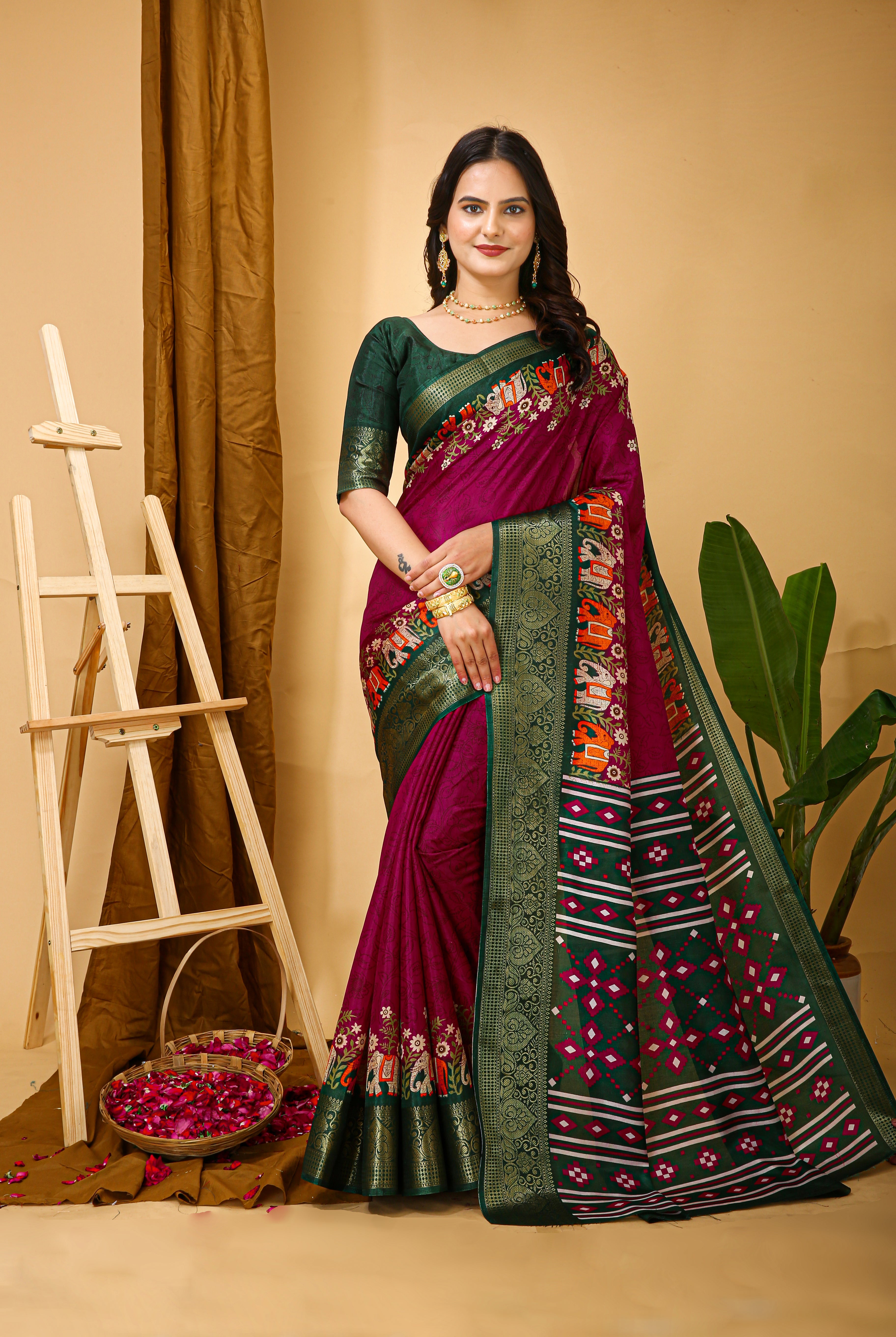 Woman wearing a traditional saree with a floral design in a warm-toned room.
