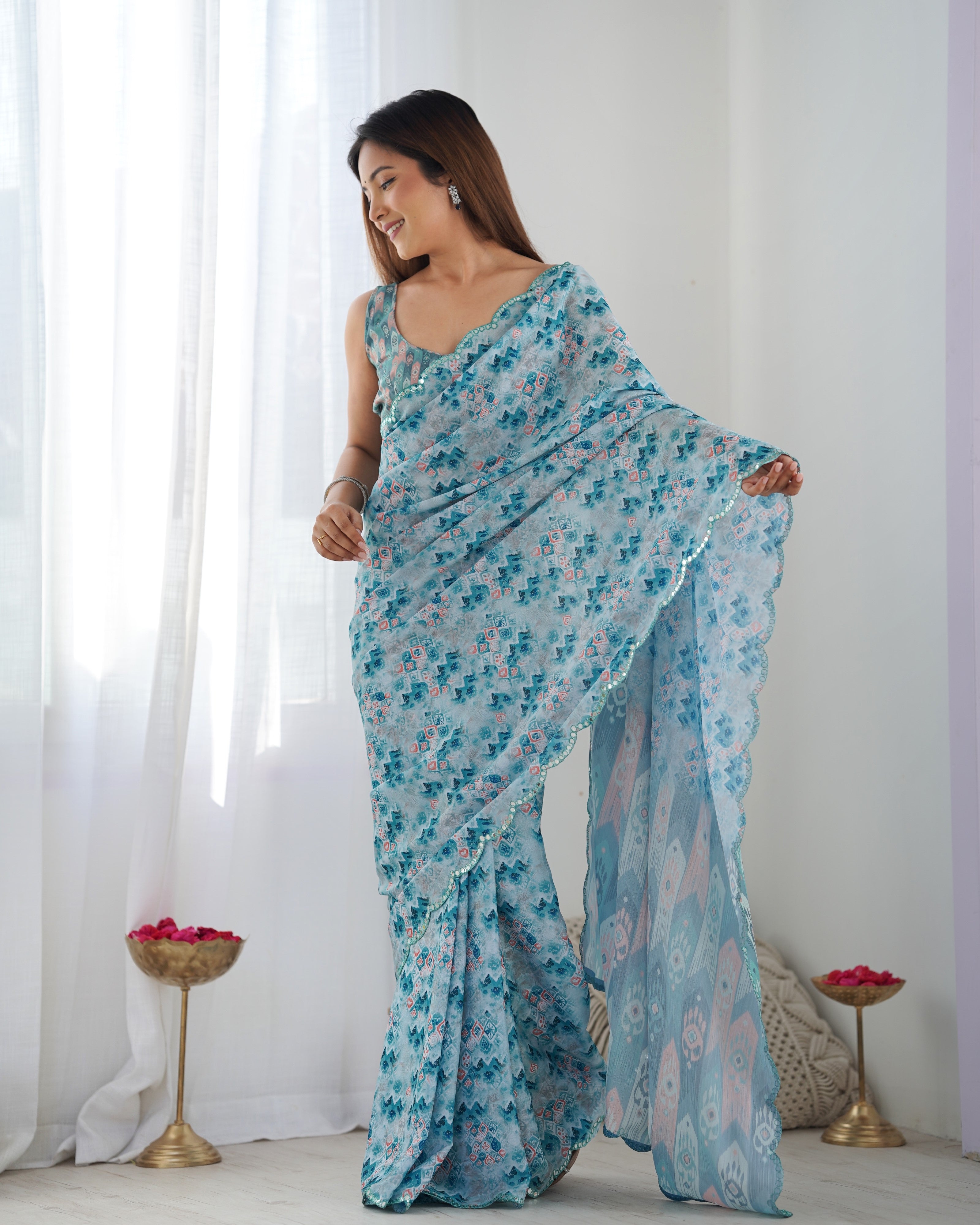 Aqua Blue Heavy Chinnon Printed Saree with Kutchi Mirror Border
