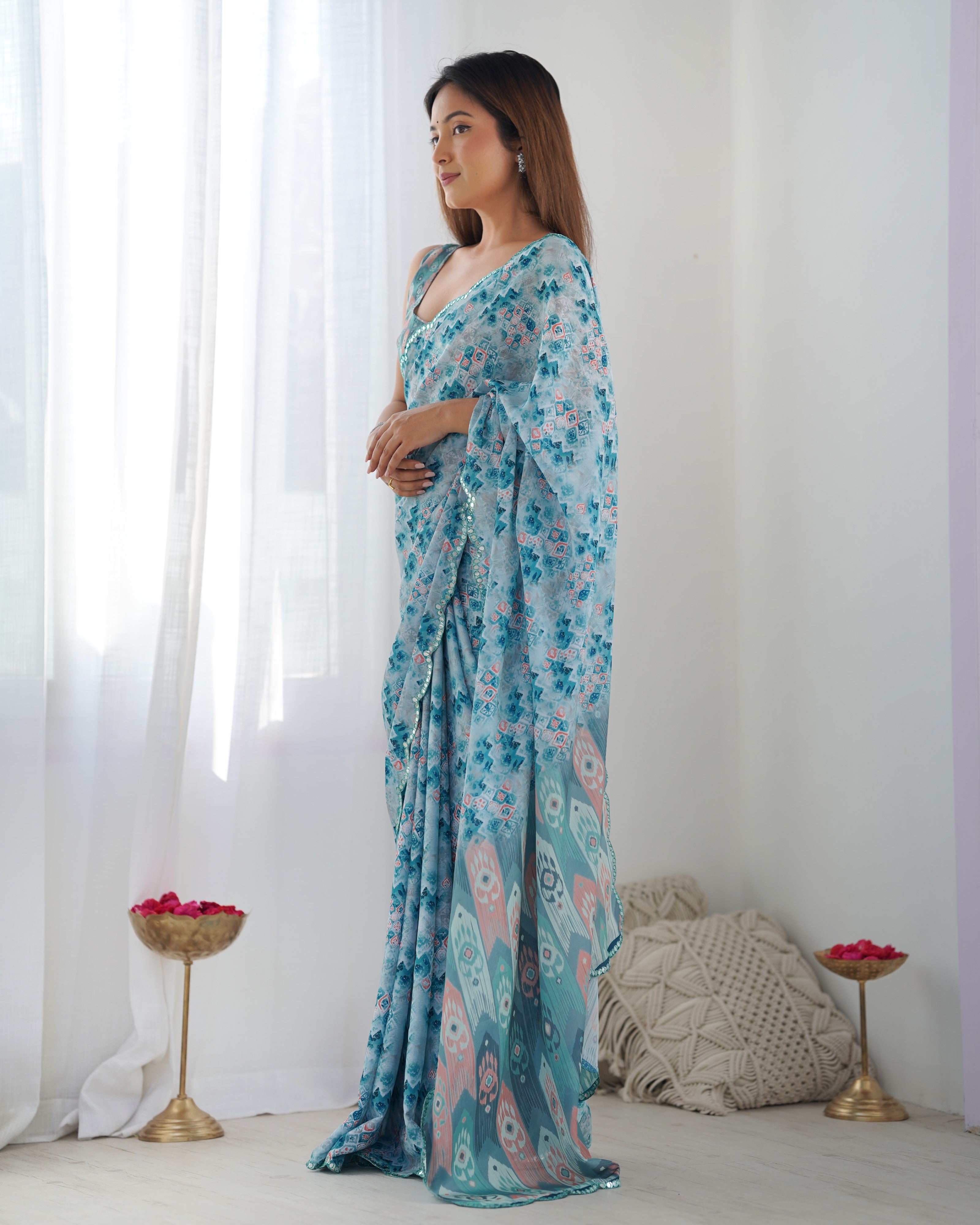 Aqua Blue Heavy Chinnon Printed Saree with Kutchi Mirror Border