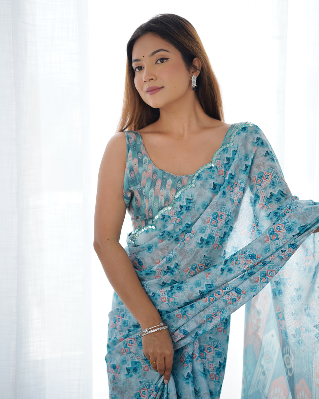 Aqua Blue Heavy Chinnon Printed Saree with Kutchi Mirror Border