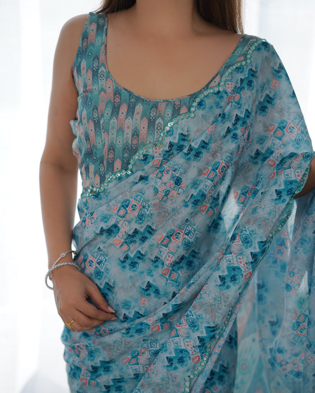 Aqua Blue Heavy Chinnon Printed Saree with Kutchi Mirror Border