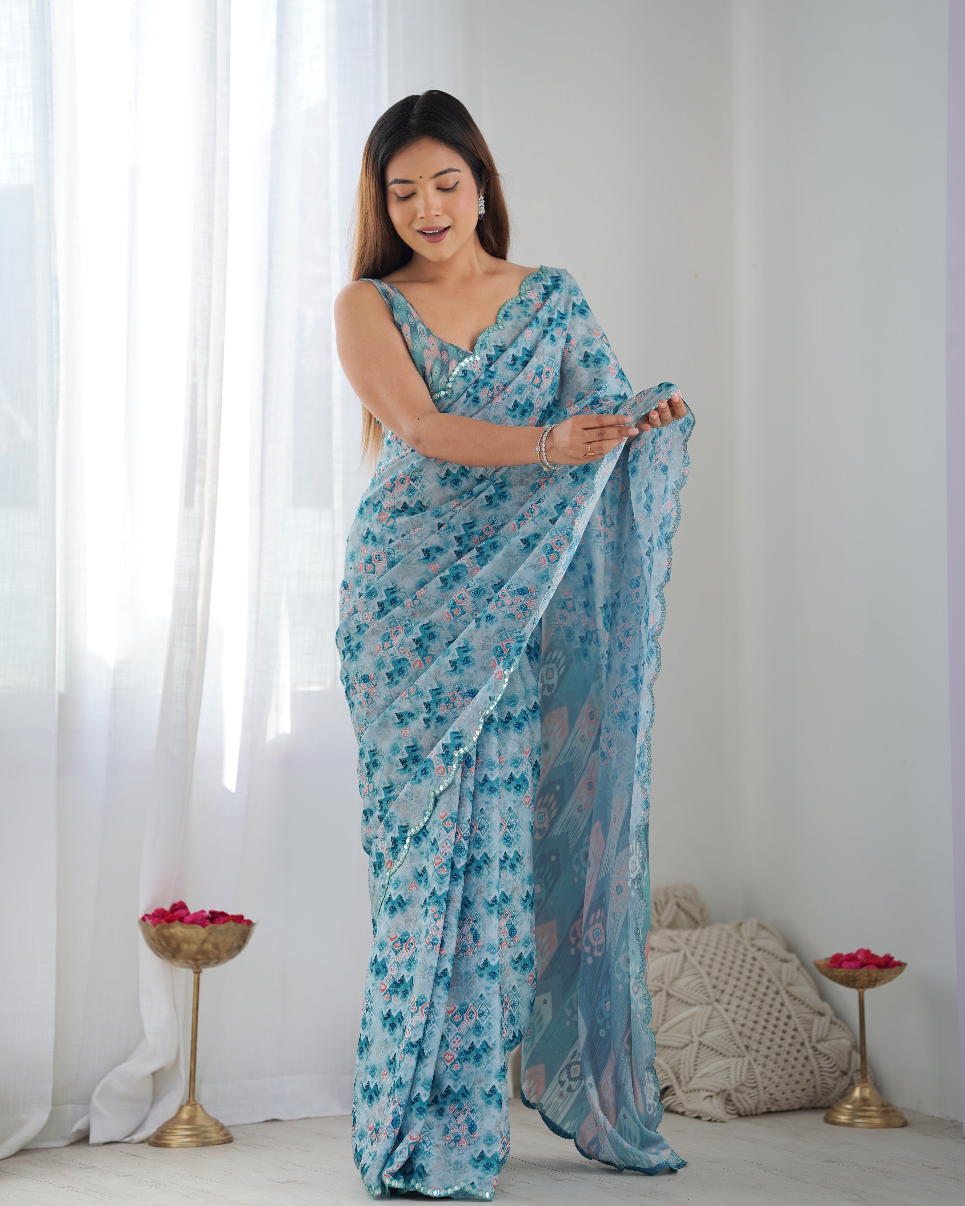 Aqua Blue Heavy Chinnon Printed Saree with Kutchi Mirror Border