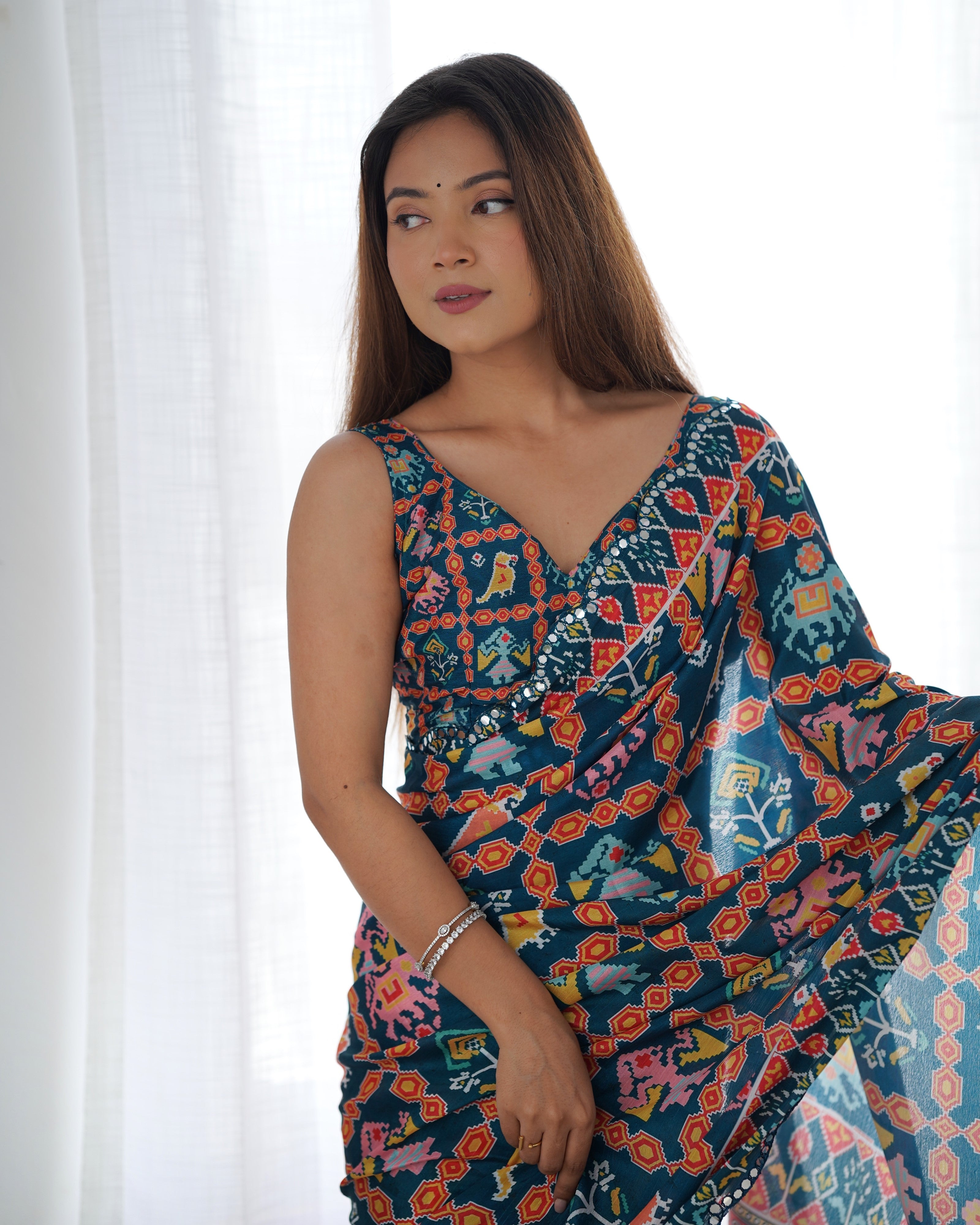 Heavy Chinnon Teal Blue Kutchi Print Saree with Mirror Lace Border