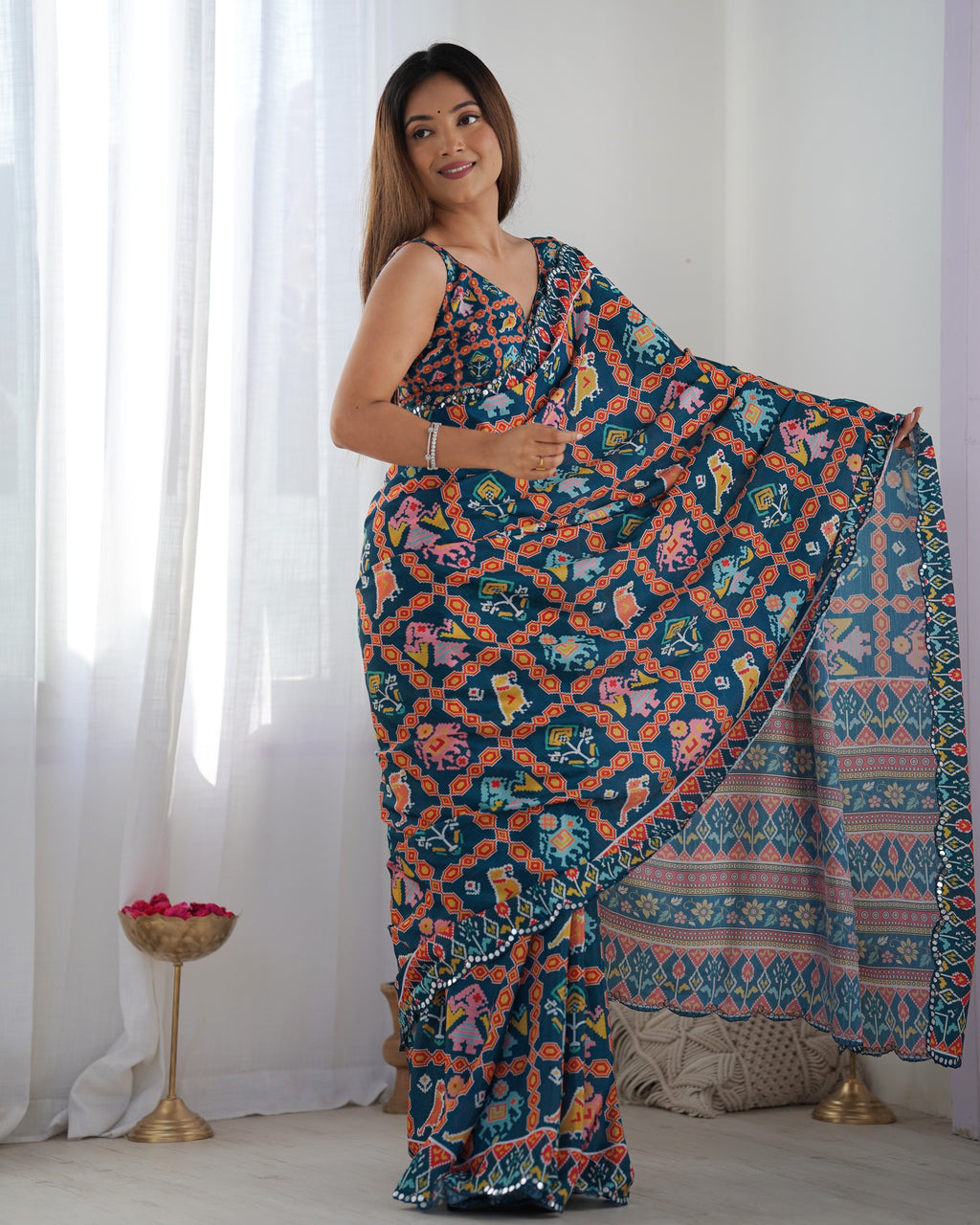 Heavy Chinnon Teal Blue Kutchi Print Saree with Mirror Lace Border