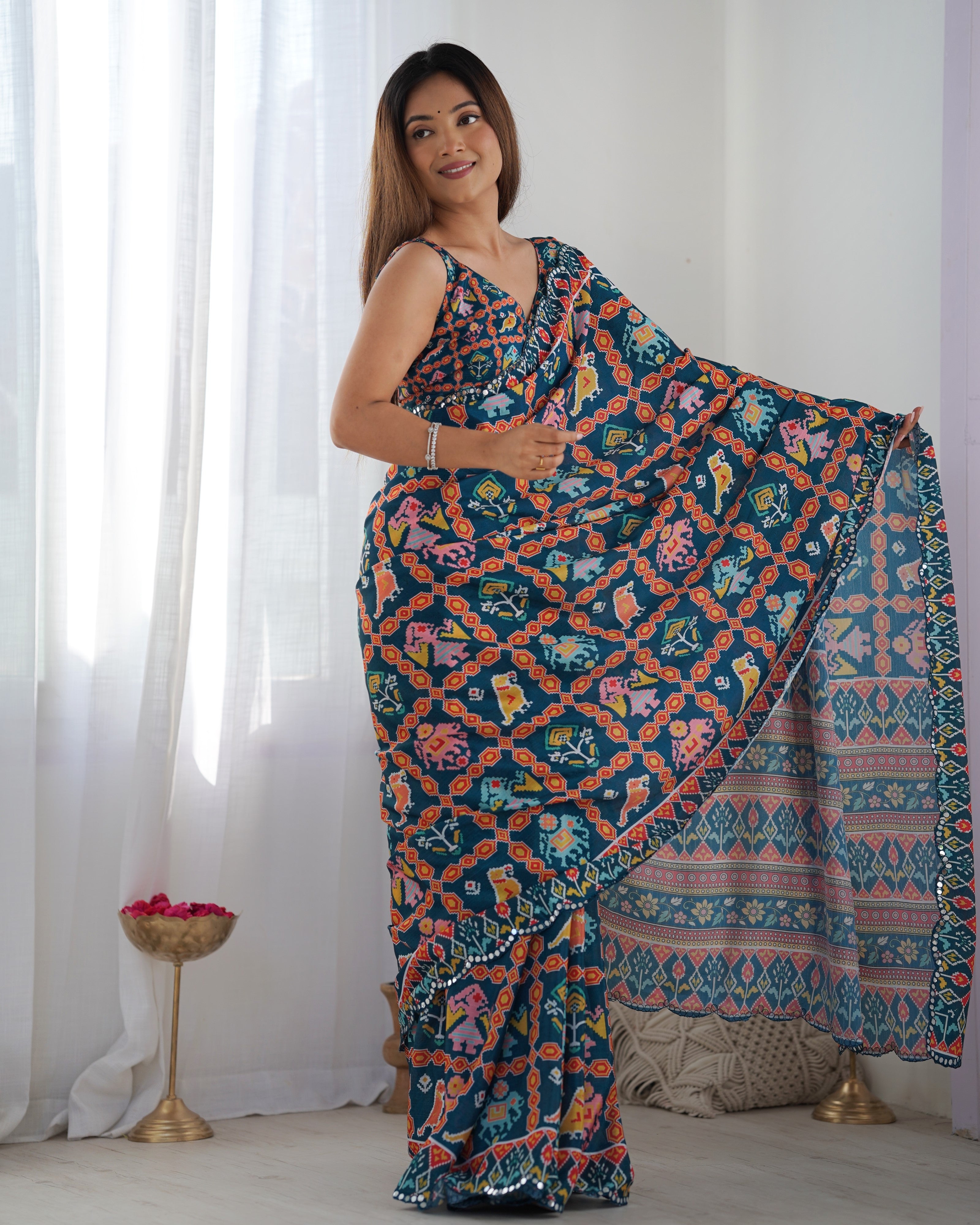 Heavy Chinnon Teal Blue Kutchi Print Saree with Mirror Lace Border