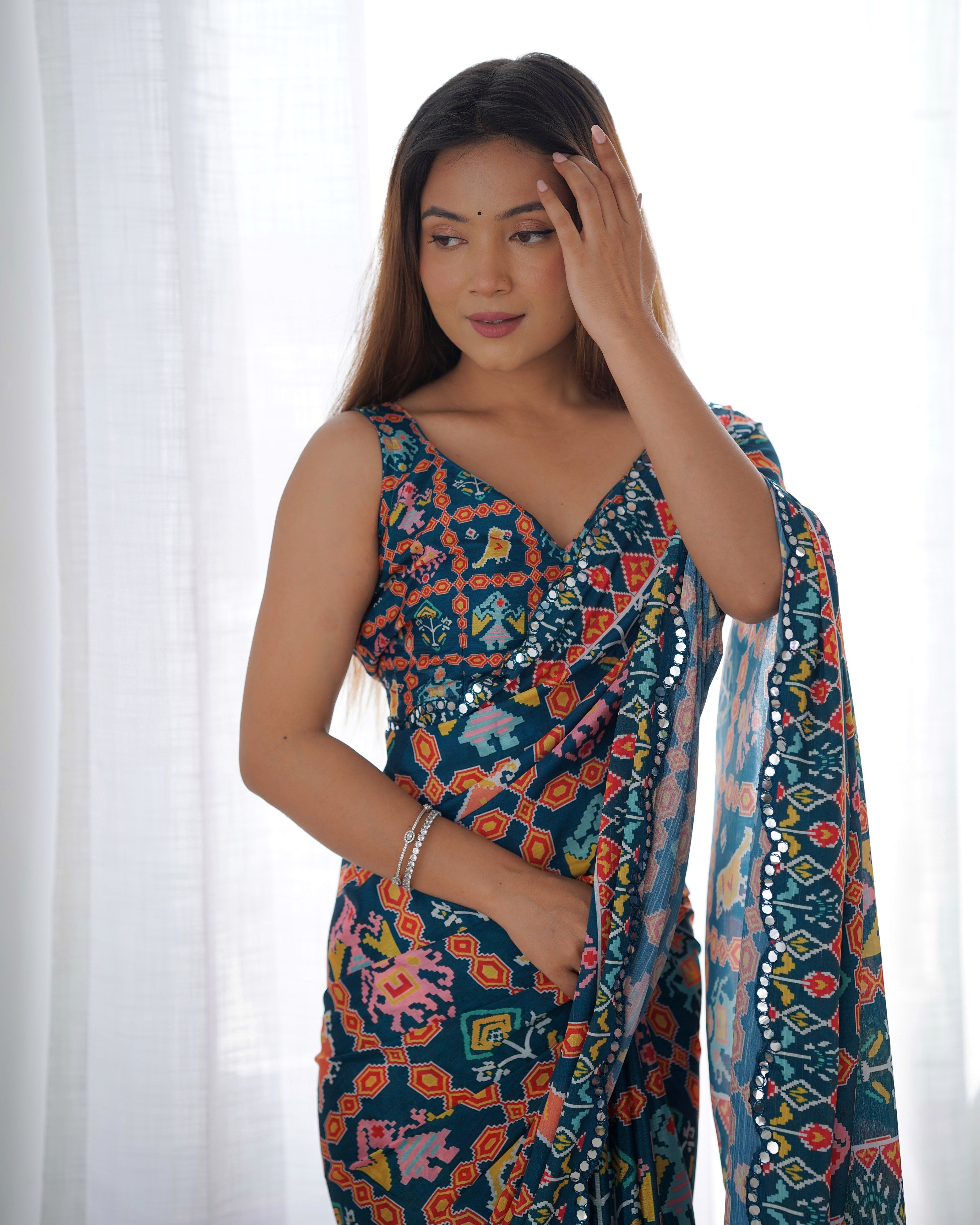 Heavy Chinnon Teal Blue Kutchi Print Saree with Mirror Lace Border