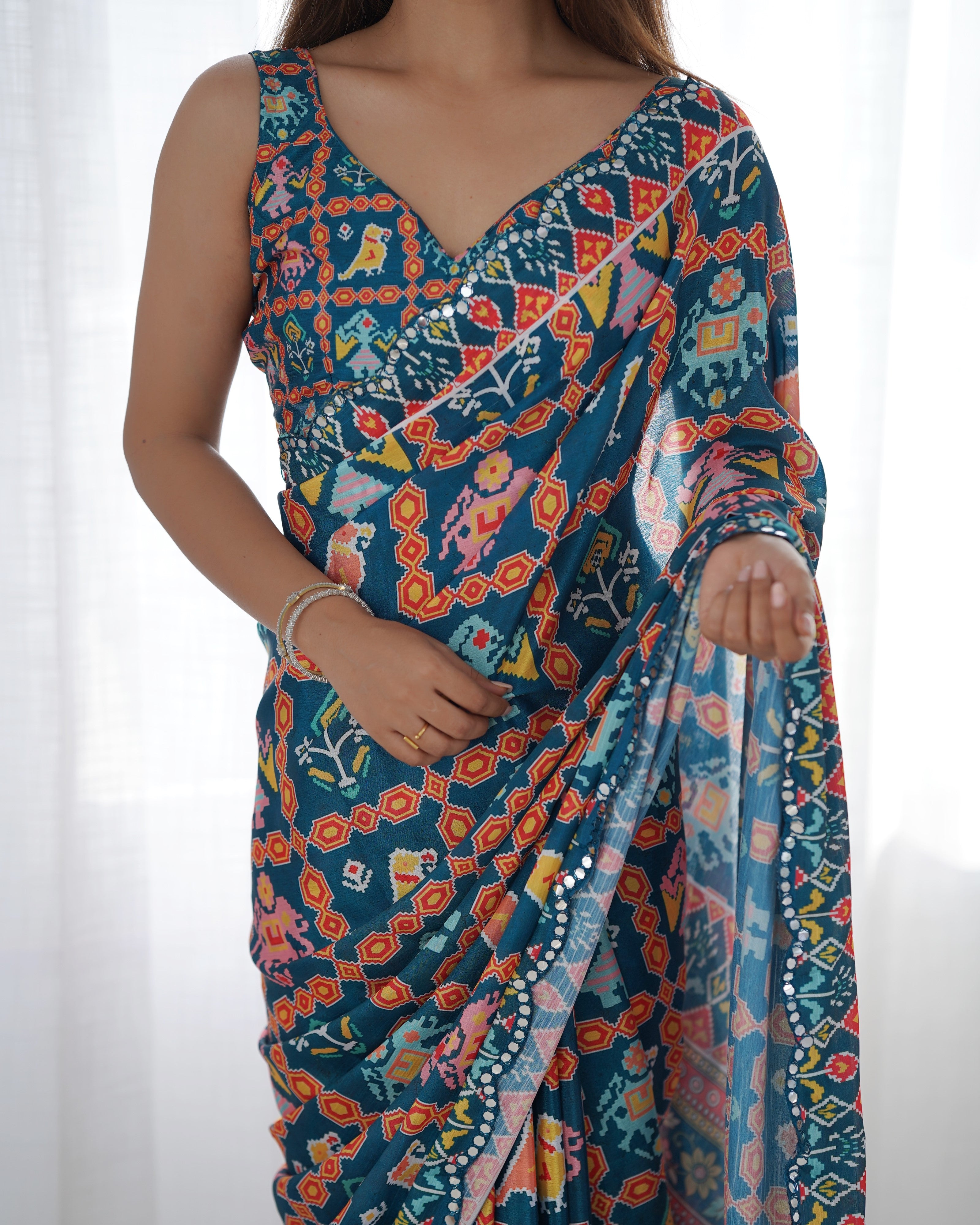 Heavy Chinnon Teal Blue Kutchi Print Saree with Mirror Lace Border