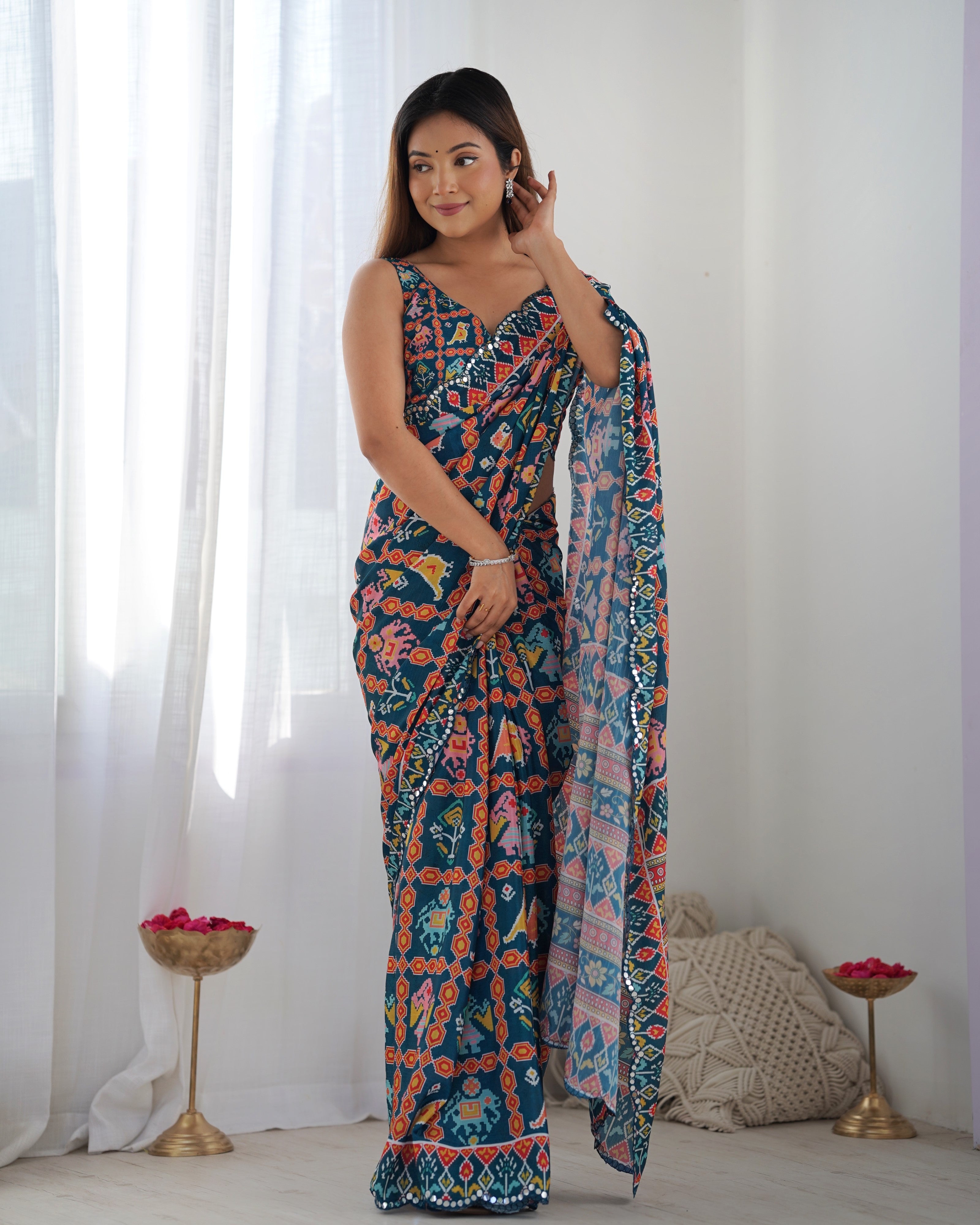 Heavy Chinnon Teal Blue Kutchi Print Saree with Mirror Lace Border