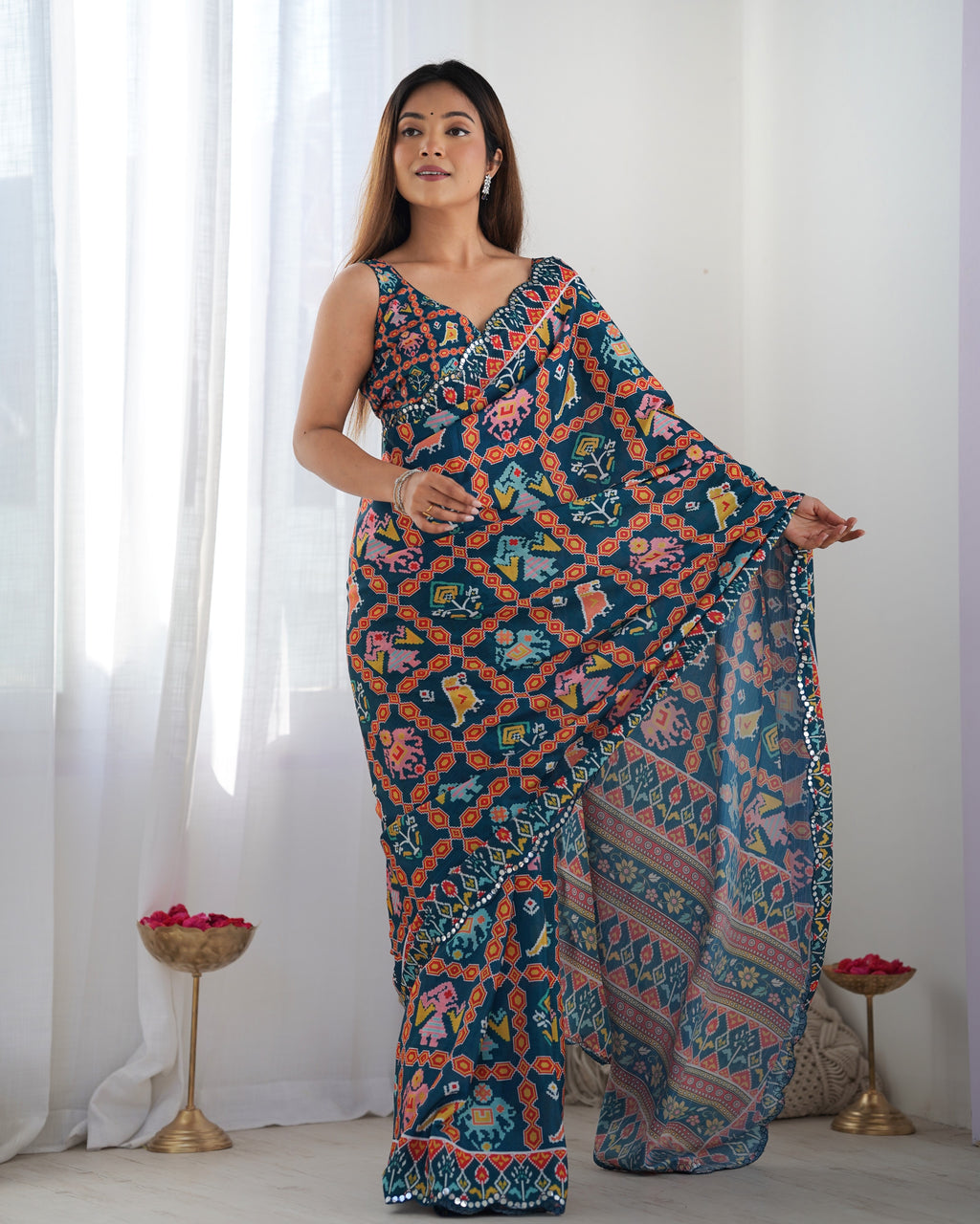 Heavy Chinnon Teal Blue Kutchi Print Saree with Mirror Lace Border