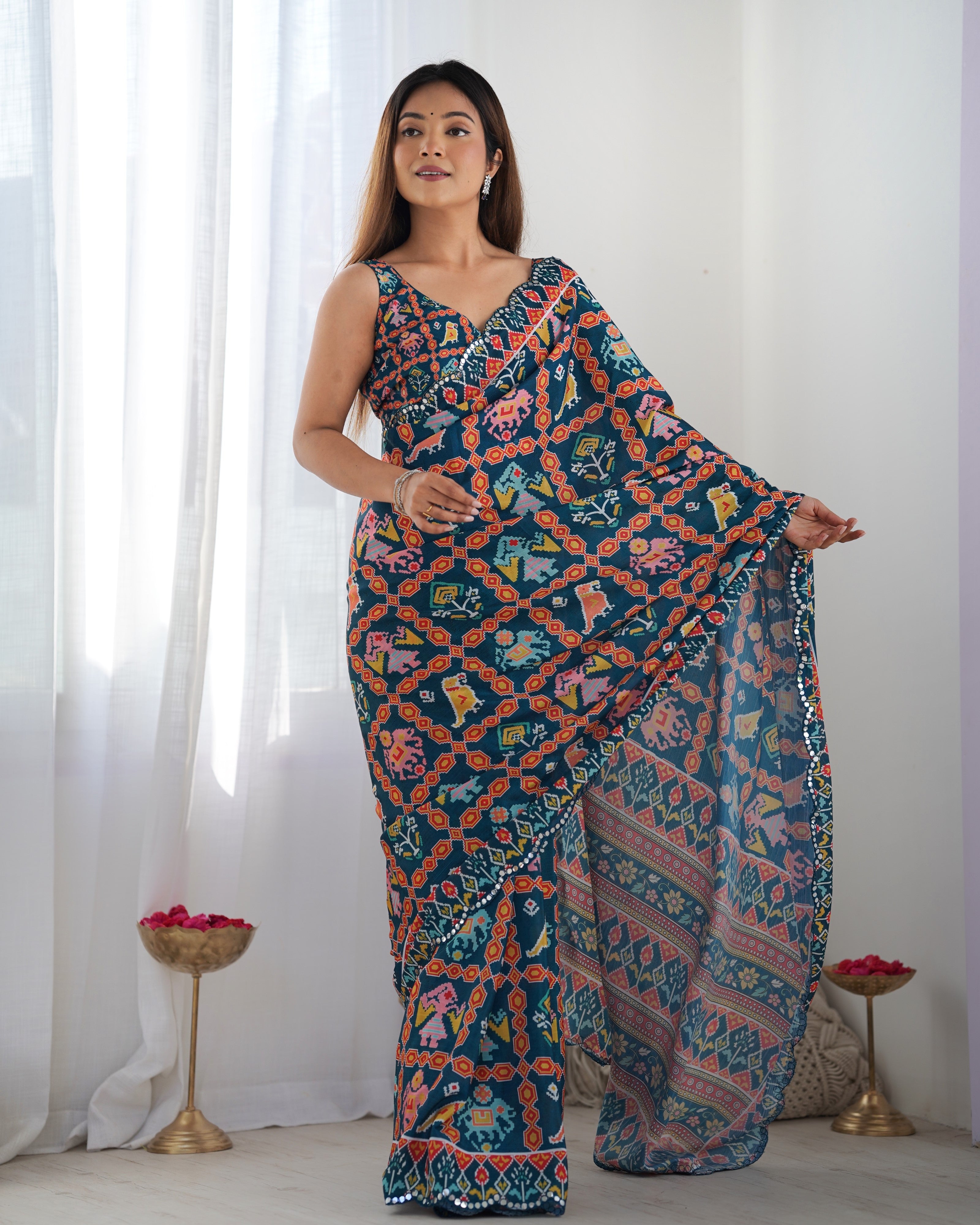 Heavy Chinnon Teal Blue Kutchi Print Saree with Mirror Lace Border