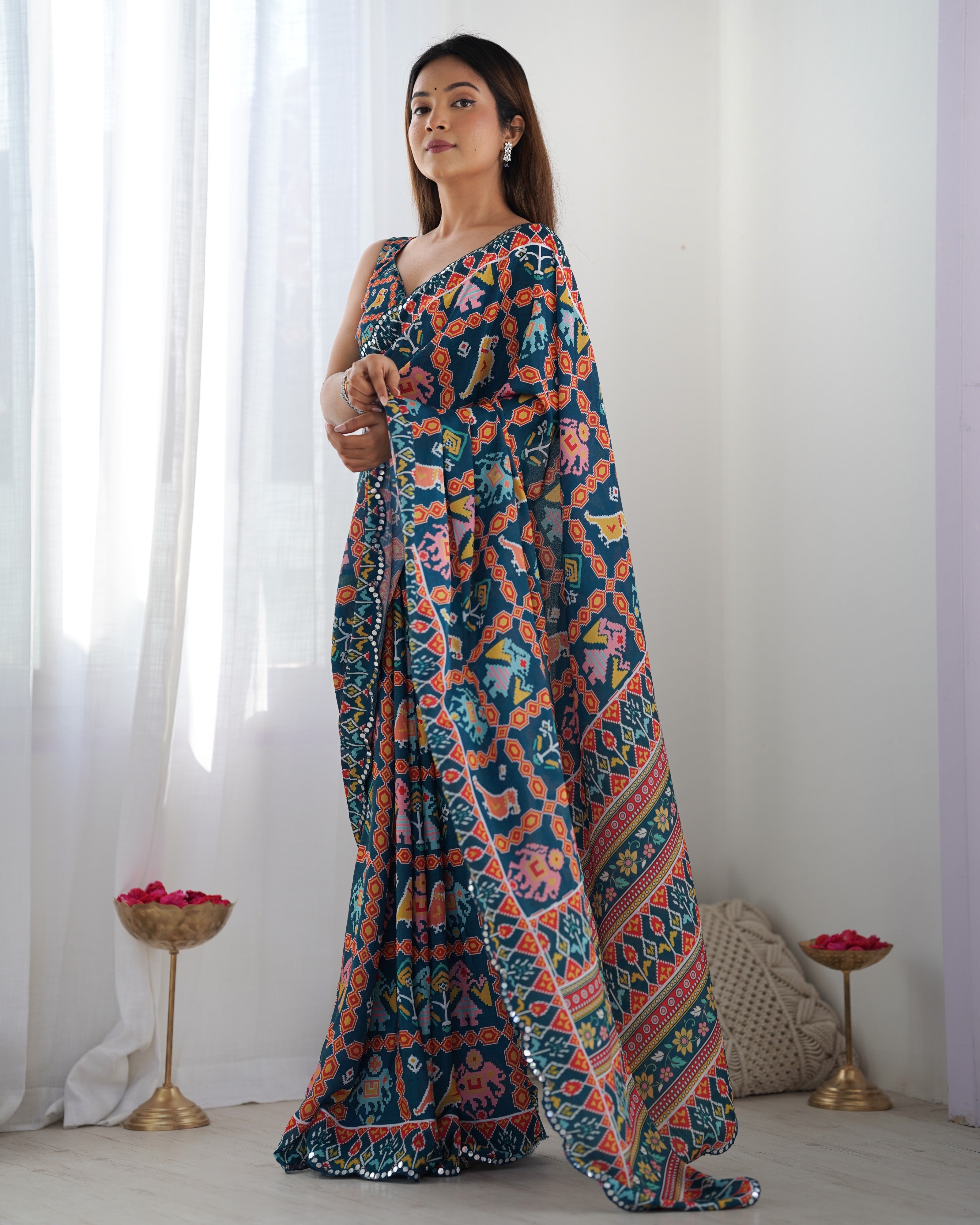 Heavy Chinnon Teal Blue Kutchi Print Saree with Mirror Lace Border