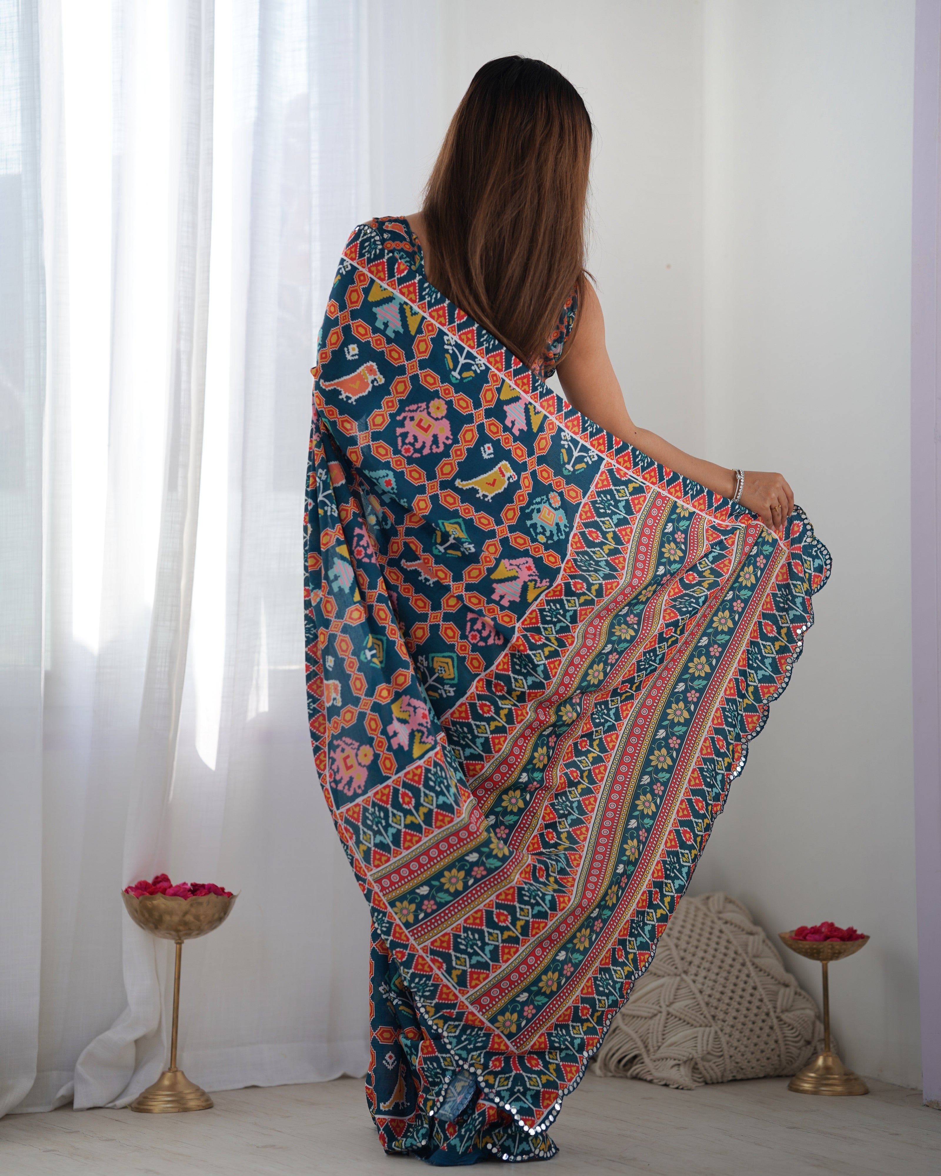 Heavy Chinnon Teal Blue Kutchi Print Saree with Mirror Lace Border