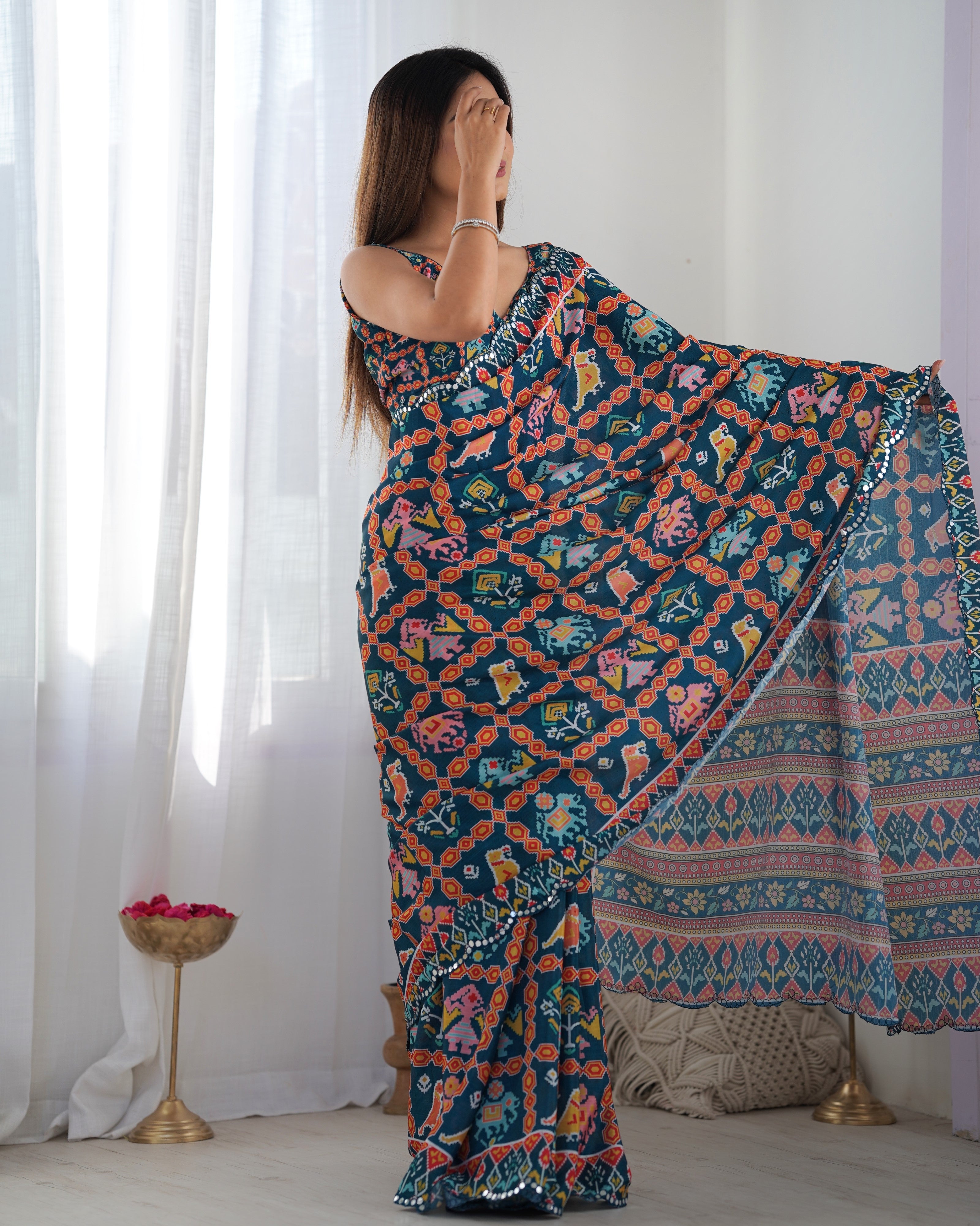Heavy Chinnon Teal Blue Kutchi Print Saree with Mirror Lace Border