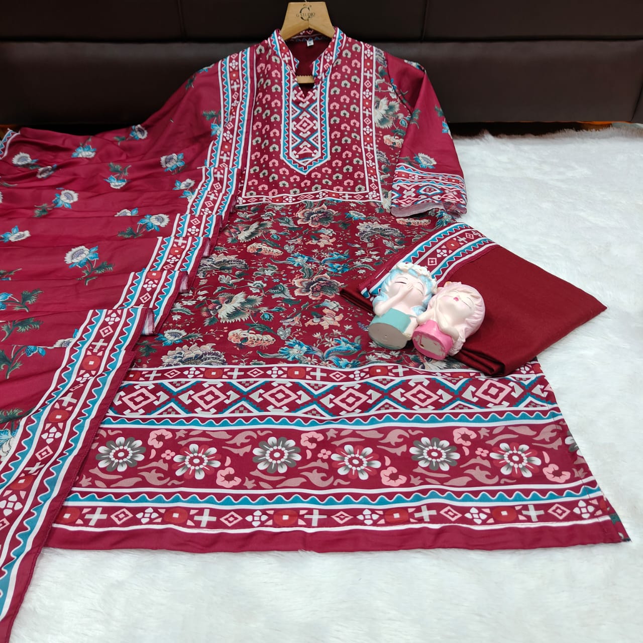 Maroon digital printed kurta set dress outfit with decorative patterns on a white surface