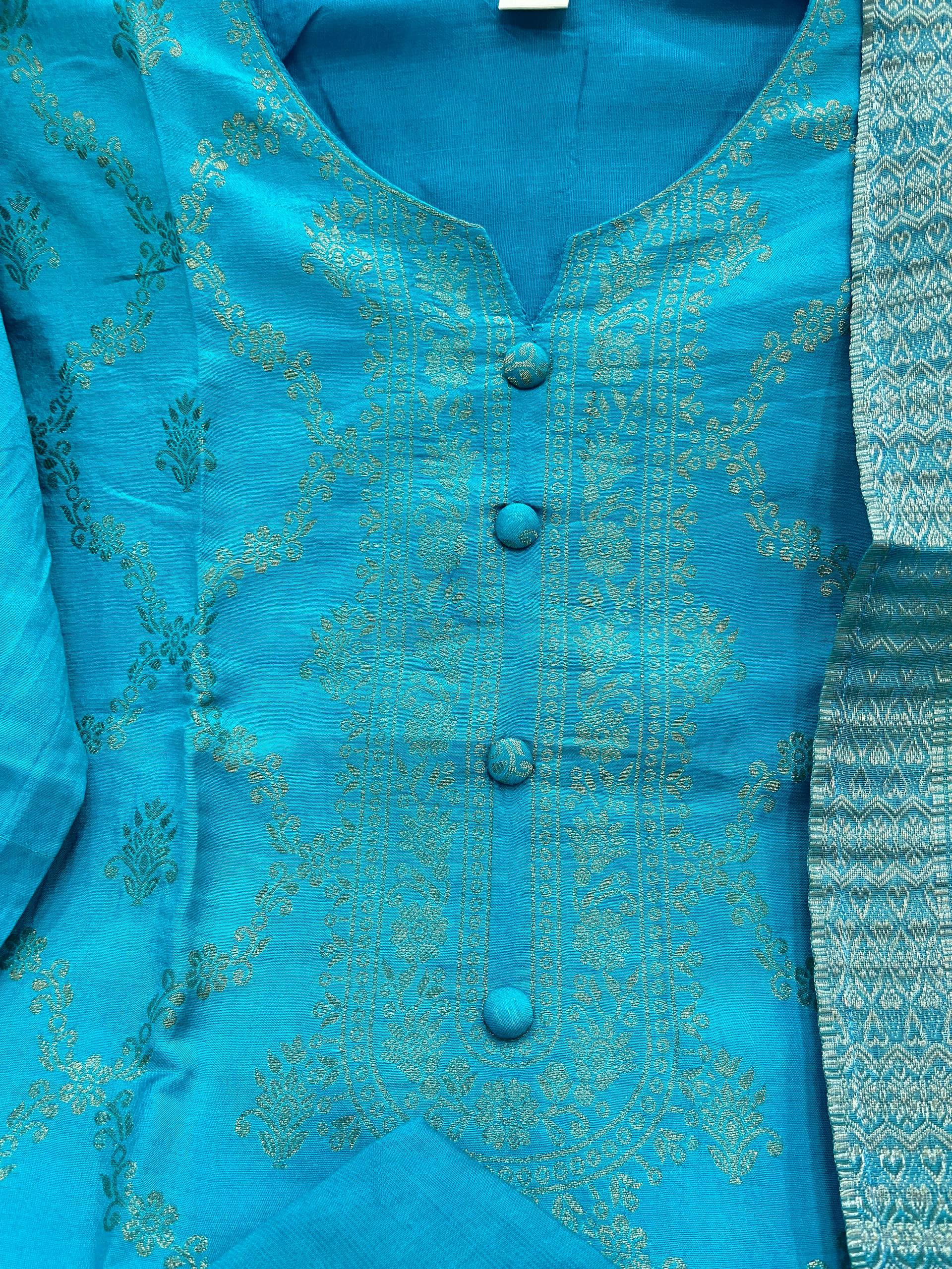 Blue kurta set with intricate patterns on a matching fabric background