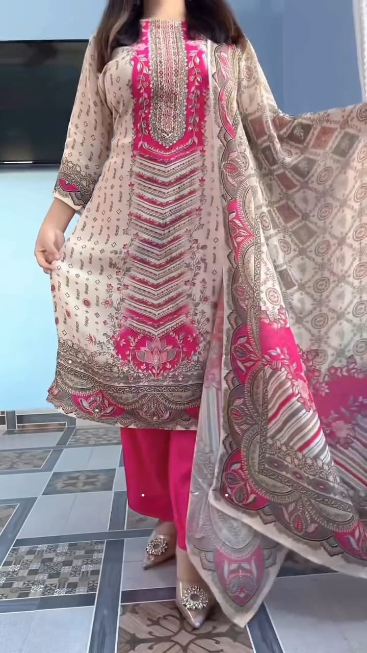 Woman wearing a pink and beige embroidered kurta set outfit with a matching dupatta.