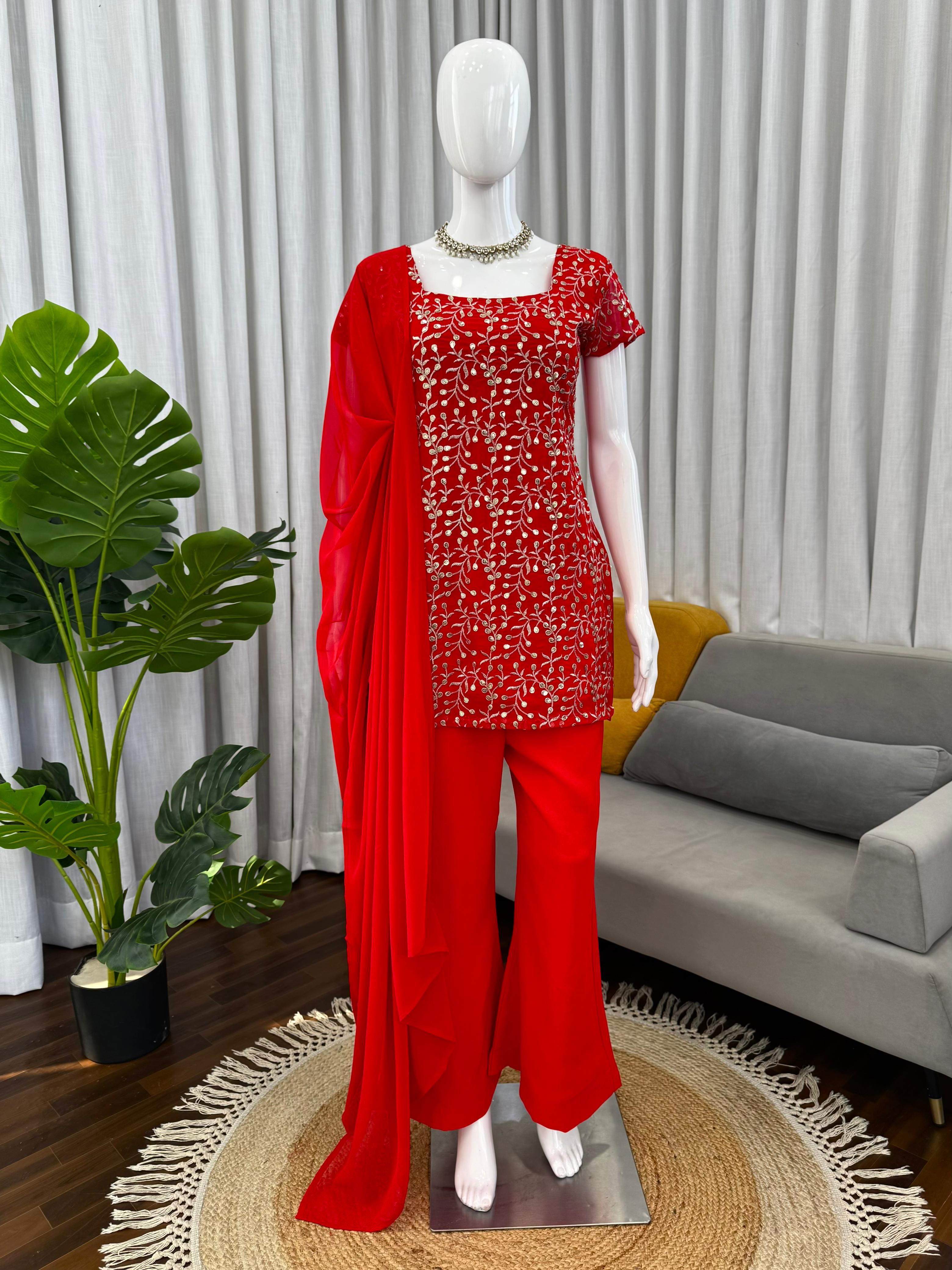 Red outfit with matching dupatta on a mannequin against a neutral background