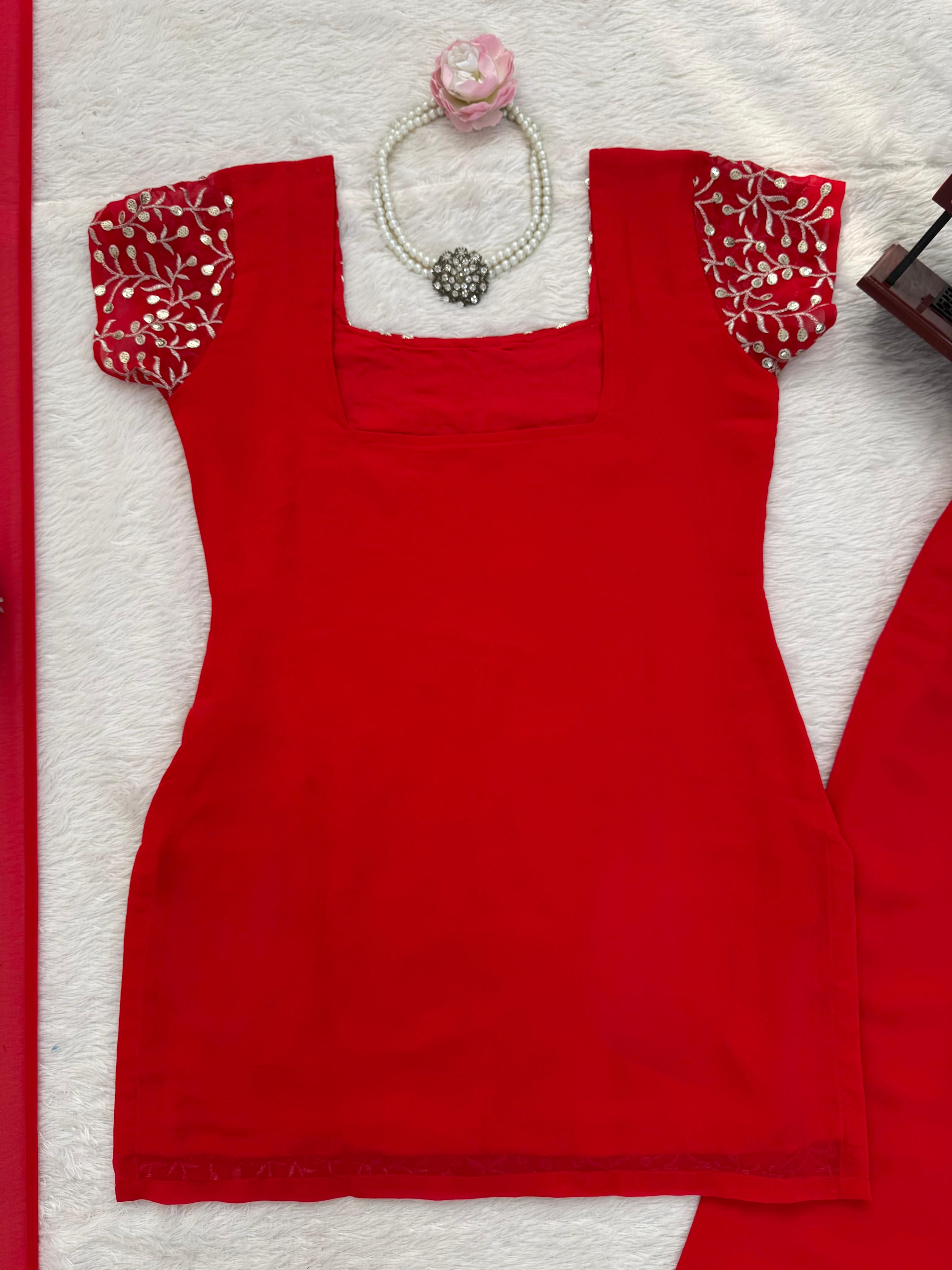 Red top with floral sleeves on a white background