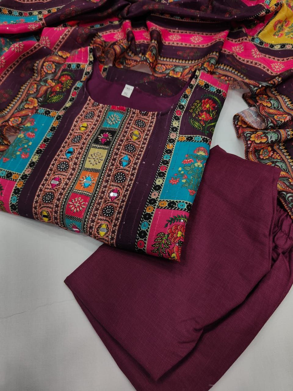 Colorful fabric with intricate patterns on a white surface