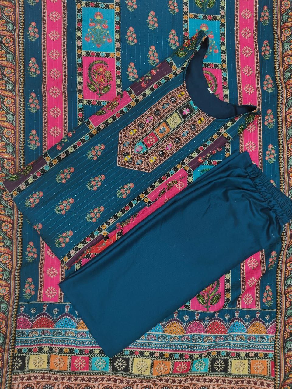 Blue swimsuit on a colorful patterned fabric background